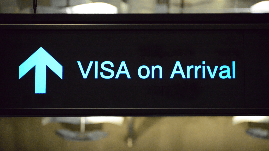 Visa on Arrival sign in Bali airport, guiding travelers on visa options.