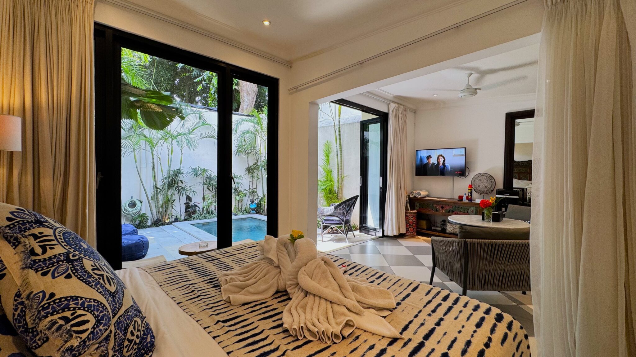 Private pool with beanbag lounge area at Villa Ibu Dua Seminyak