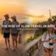 Couple enjoying a peaceful sunrise walk on Seminyak Beach during their slow travel in Bali experience.