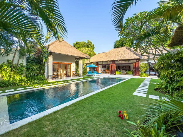 Tropical garden and swimming pool area at Villa Alore, a 6 bedroom Seminyak villa ideal for group stays