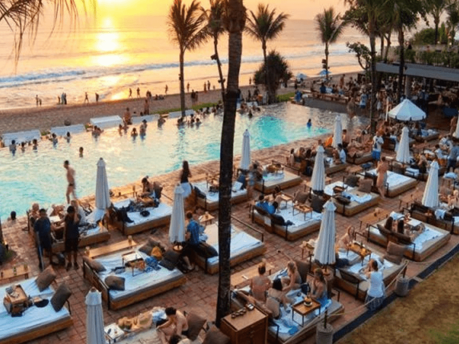 Beachfront beach club at sunset in Seminyak