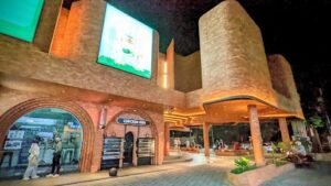Night view of Bintang Supermarket's modern exterior in Seminyak — just a 6-minute walk from Villa Cemara & Villa Alore, perfect for guests who value convenience and easy access to daily needs.