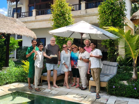Villa Bugis team welcoming a family arriving at their private villa in Seminyak