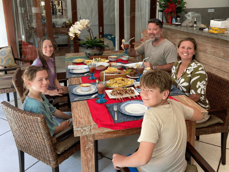 Family enjoying breakfast at the private dining table of a Villa Bugis villa in Seminyak
