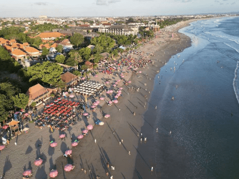 Aerial view of Seminyak Beach in Bali with beach clubs along the shoreline