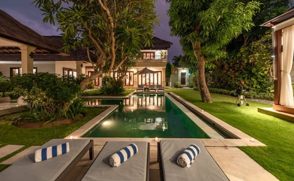 Second Villa Seminyak, a 3 bedroom villa in Seminyak featuring a private swimming pool, lush garden, and luxurious lounging areas for a Bali getaway.