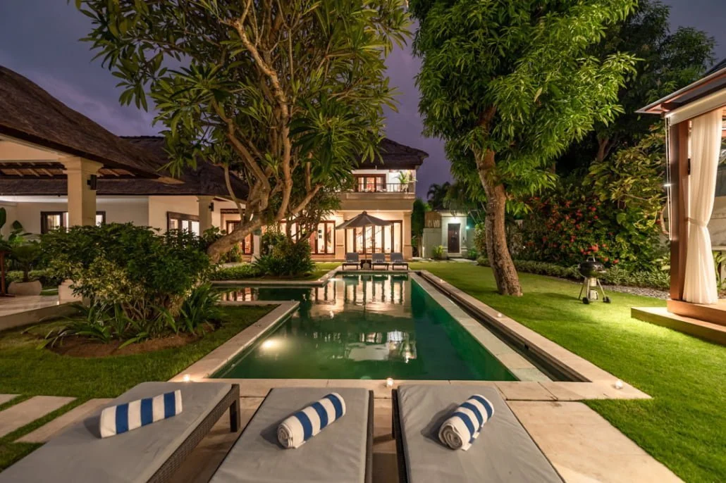 Second Villa Seminyak, a 3 bedroom villa in Seminyak featuring a private swimming pool, lush garden, and luxurious lounging areas for a Bali getaway.