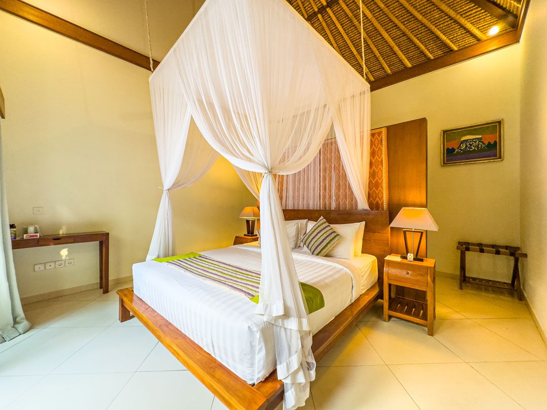 Luxurious fifth bedroom with a king-size bed at Villa Alore Seminyak by Villa Bugis, providing quiet privacy in a large villa Seminyak.