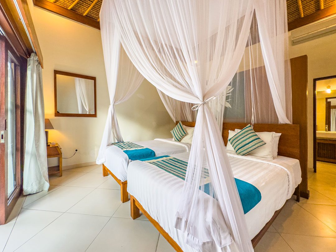 Comfortable fourth guest bedroom with twin beds at Villa Alore Seminyak by Villa Bugis, a spacious choice among Seminyak villas.