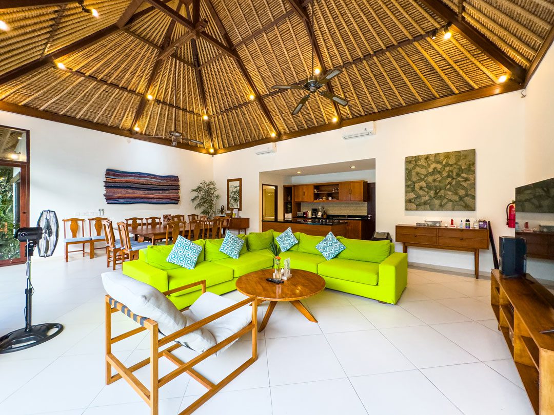 High-ceiling Balinese architectural design of the main living area at Villa Alore Seminyak by Villa Bugis Seminyak villas.