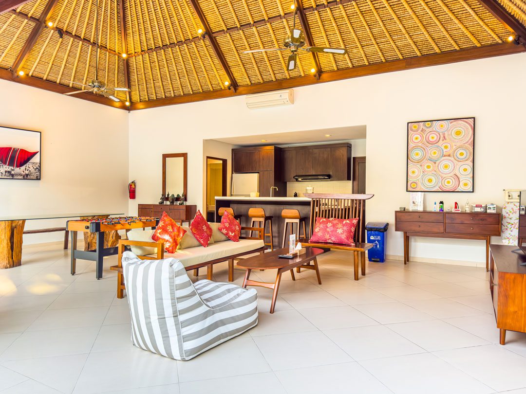 Tropical indoor-outdoor living concept overlooking the pool and garden at Villa Alore Seminyak by Villa Bugis Seminyak villas.