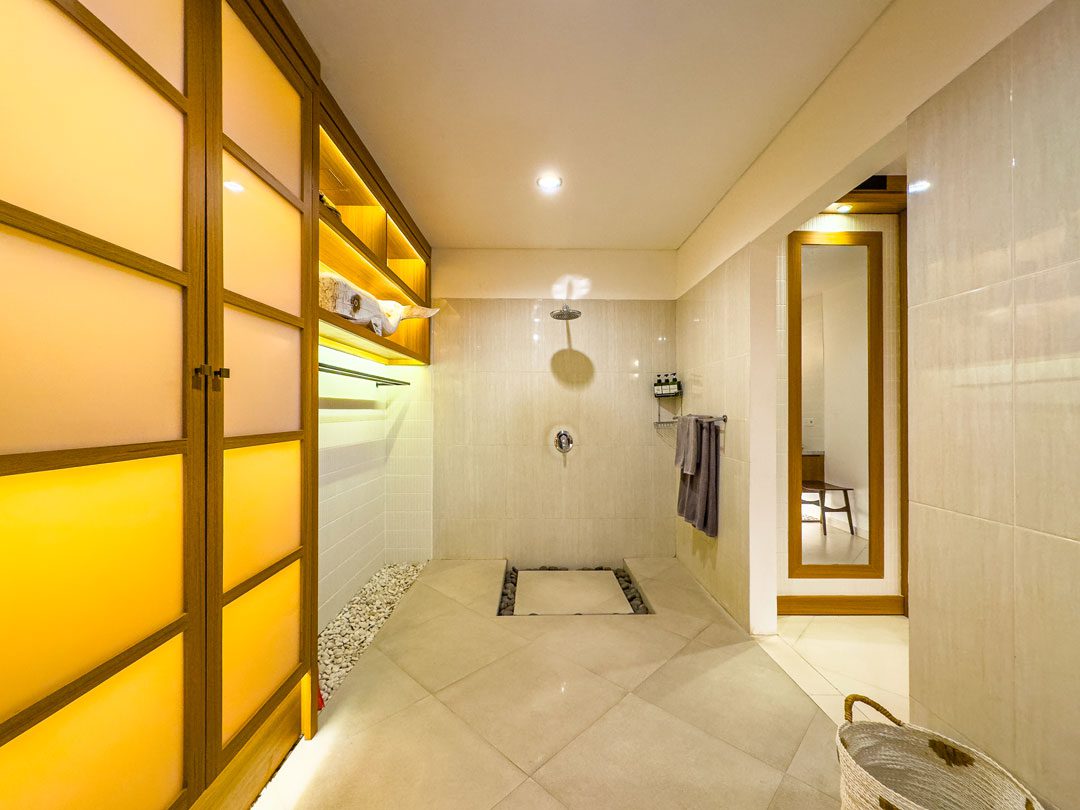 Pristine vanity and modern shower amenities in the ensuite bathroom of bedroom 1 at Villa Alore Seminyak by Villa Bugis Seminyak villas.