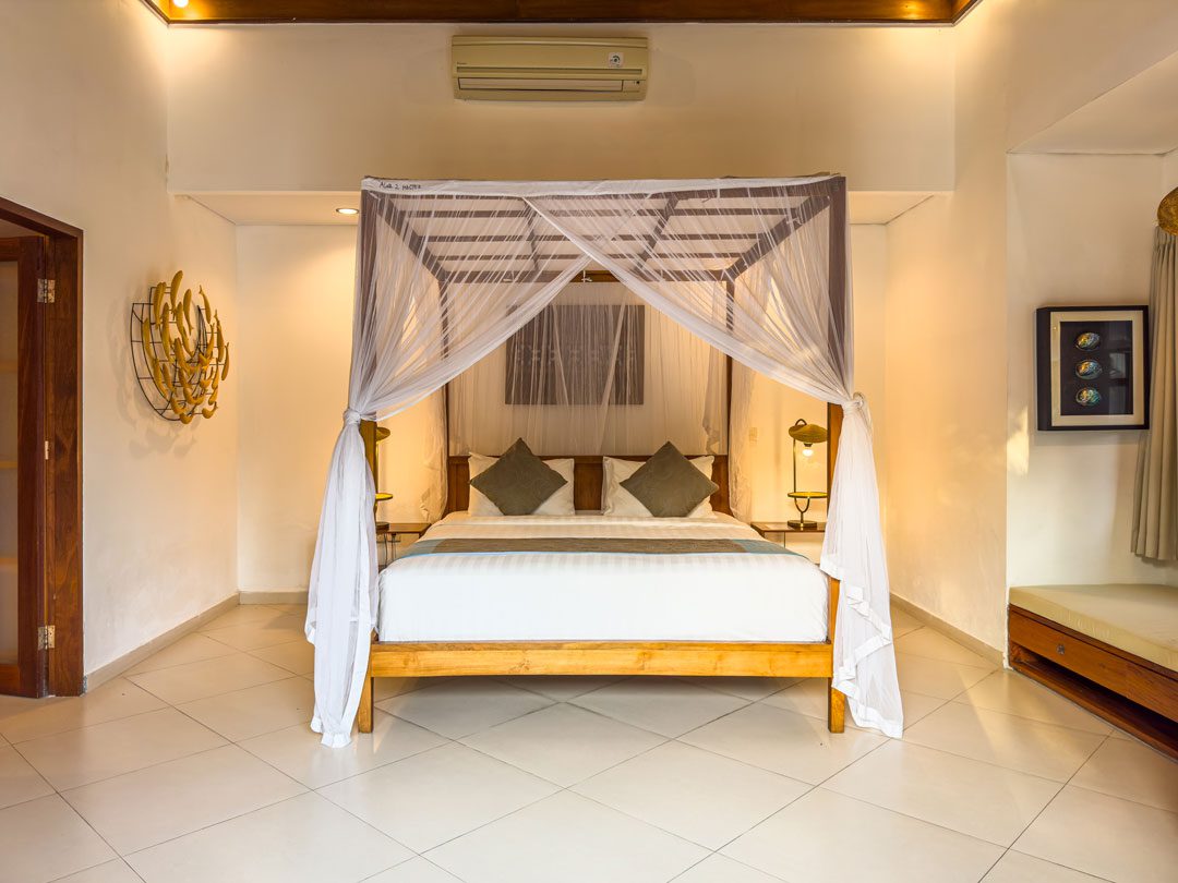 Master bedroom suite featuring a comfortable king-size bed at Villa Alore Seminyak by Villa Bugis, a luxury villa Seminyak.