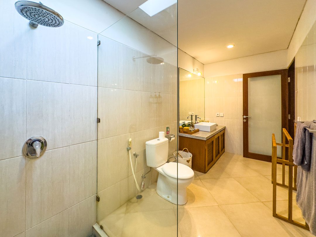 Well-lit vanity and pristine toilet facilities in bathroom 4 at Villa Alore Seminyak by Villa Bugis villa Seminyak.