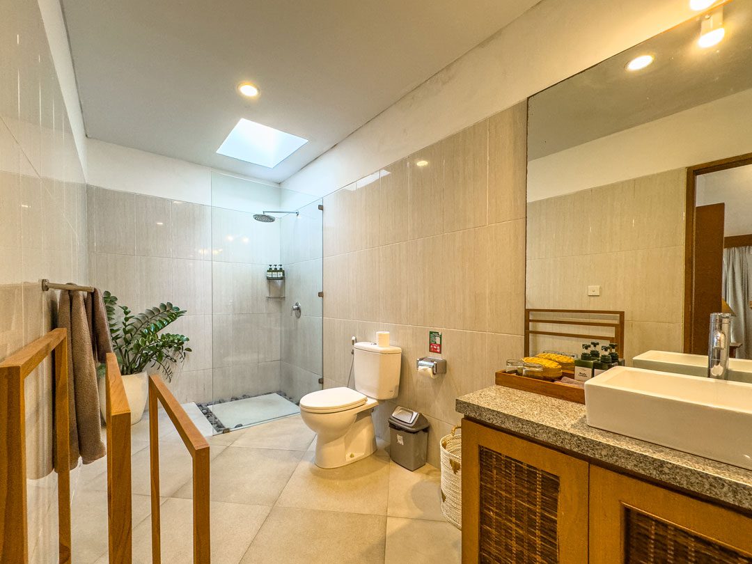 Private ensuite bathroom with modern fixtures for bedroom 2 at Villa Alore Seminyak by Villa Bugis Seminyak villas.
