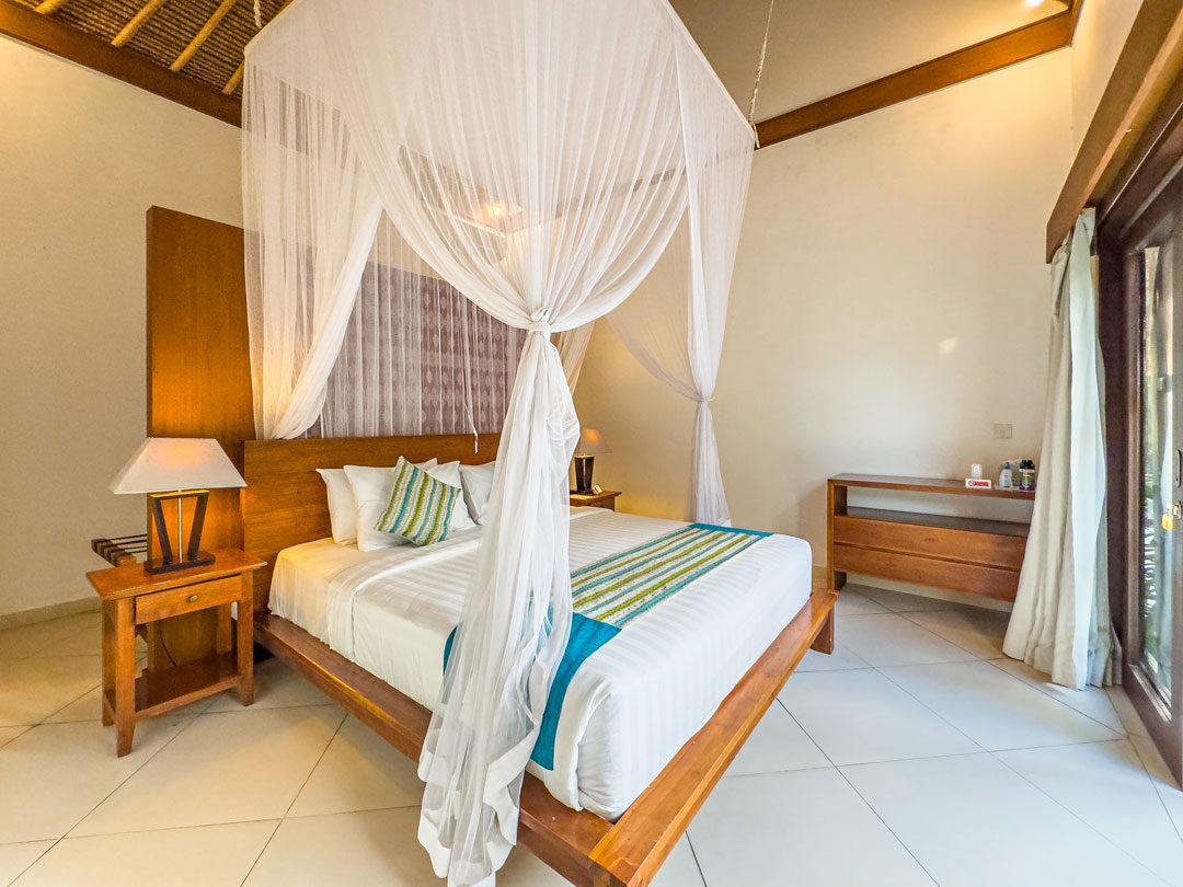 Elegant second bedroom with a king-size bed setup at Villa Alore Seminyak by Villa Bugis, ideal for families staying in Seminyak villas.