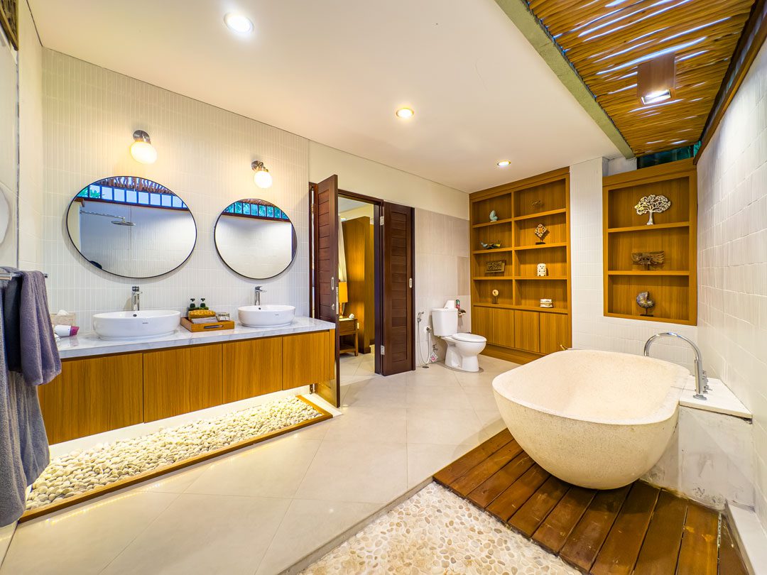 Pristine shower space and vanity setup in the private bathroom of bedroom 6 at Villa Alore Seminyak by Villa Bugis Seminyak villas.