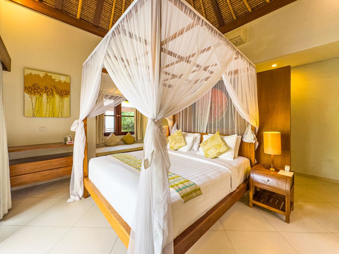 Spacious sixth bedroom with a comfortable king-size bed at Villa Alore Seminyak by Villa Bugis, ideal for group luxury in Seminyak villas.