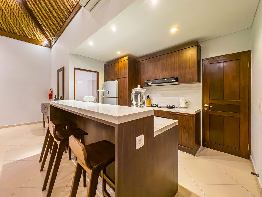 Spacious kitchen counter and dining preparation area at Villa Alore Seminyak by Villa Bugis, offering self-catering convenience in Seminyak villas.