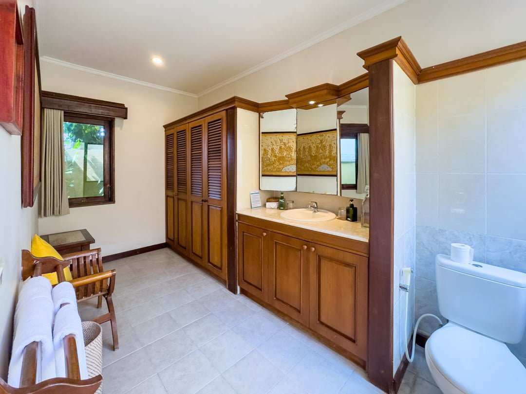 Ensuite tropical bathroom for bedroom 3 at Villa Arjuna Seminyak by Villa Bugis, equipped with a modern refreshing shower in this villa Seminyak.