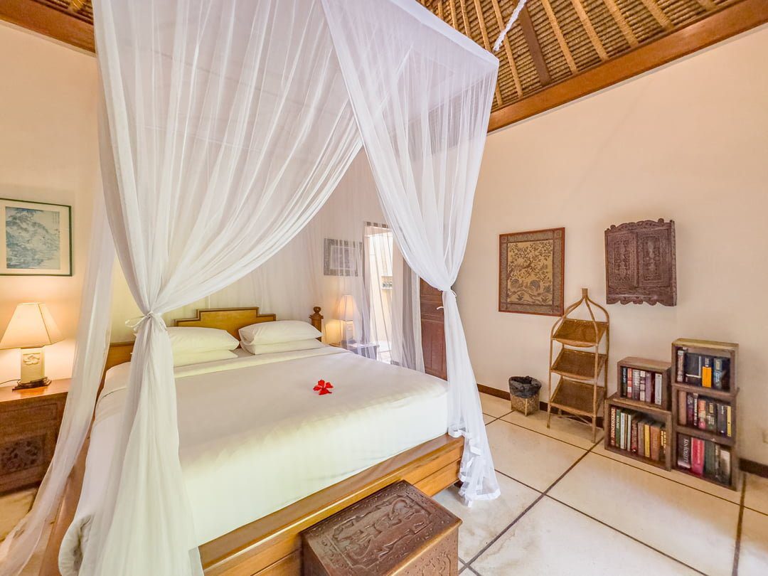 Serene third bedroom at Villa Arjuna Seminyak by Villa Bugis villa Seminyak with premium bedding and a direct view overlooking the pool area.