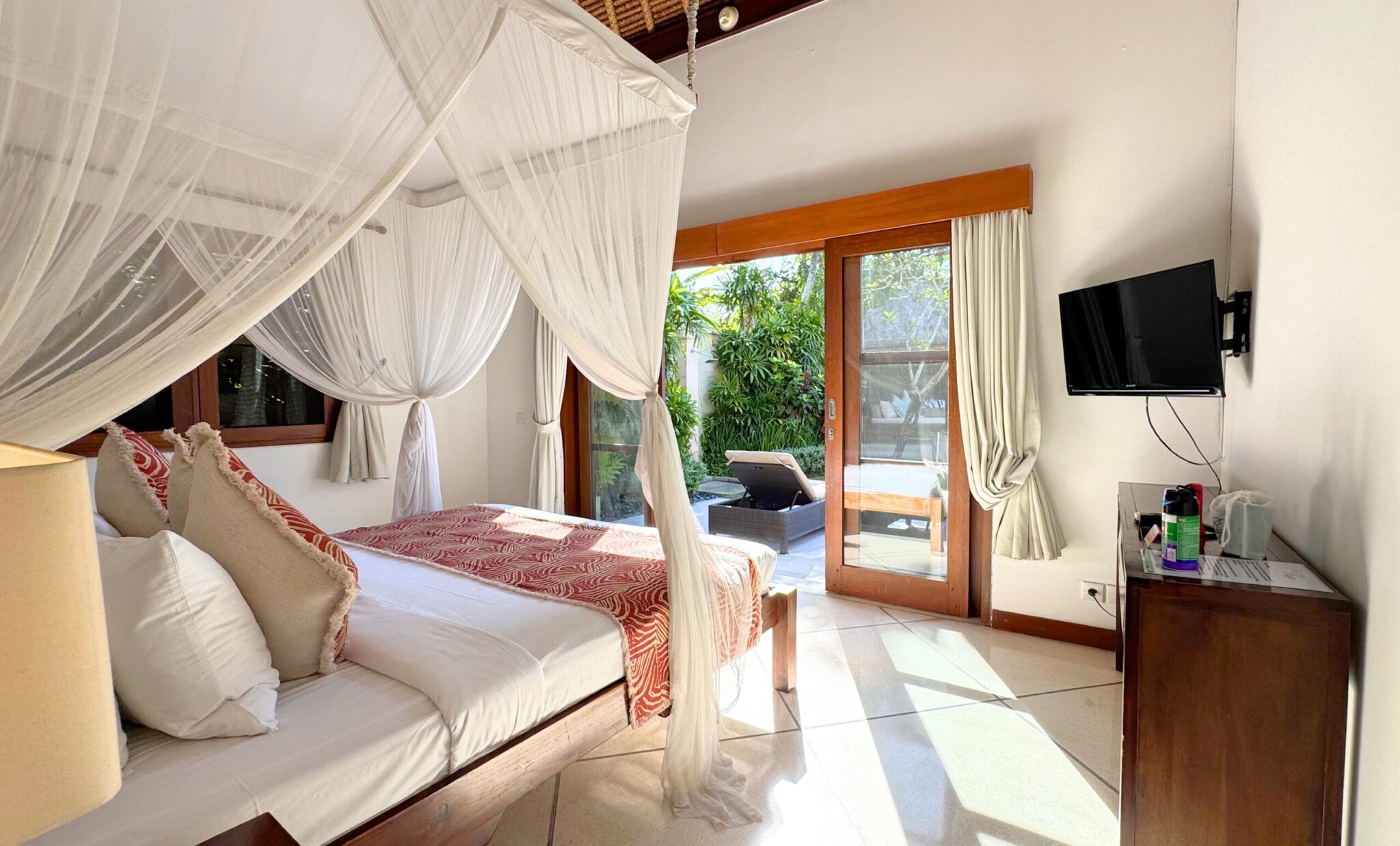 Warm and private ambiance with garden views in bedroom 5 at Villa Darma Seminyak by Villa Bugis, part of the luxury Seminyak villas holiday rentals.