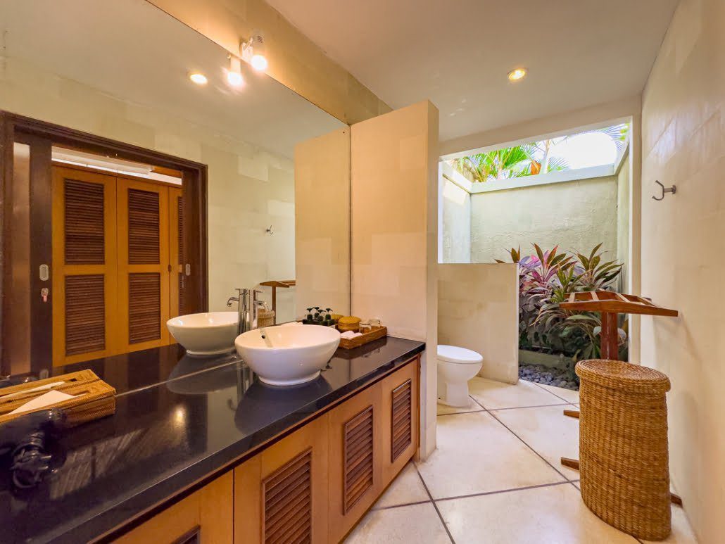 Ensuite luxury bathroom in the master suite at Villa Darma Seminyak by Villa Bugis, featuring a tropical semi-open design villa Seminyak.