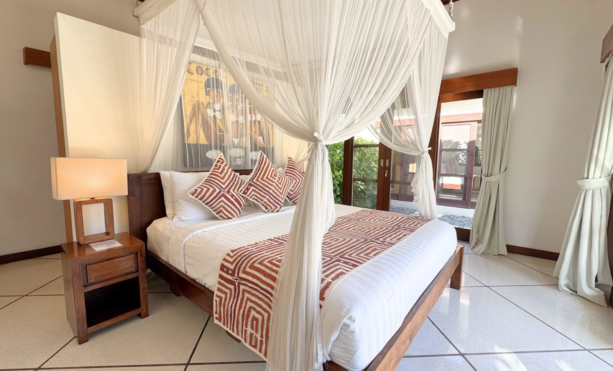 Cozy second bedroom at Villa Darma Seminyak by Villa Bugis villa Seminyak, displaying aesthetic tropical decor with fully-equipped amenities.