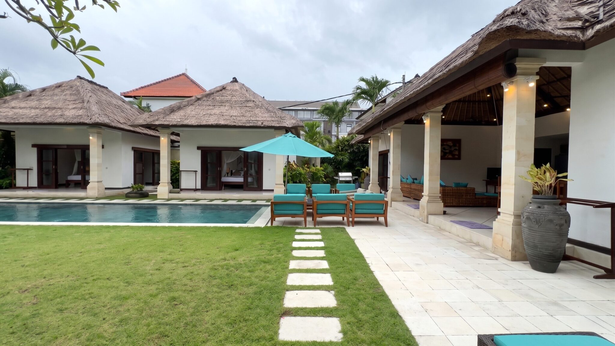 Landscaped tropical garden and pool deck at Villa Darma Seminyak by Villa Bugis Seminyak villas.
