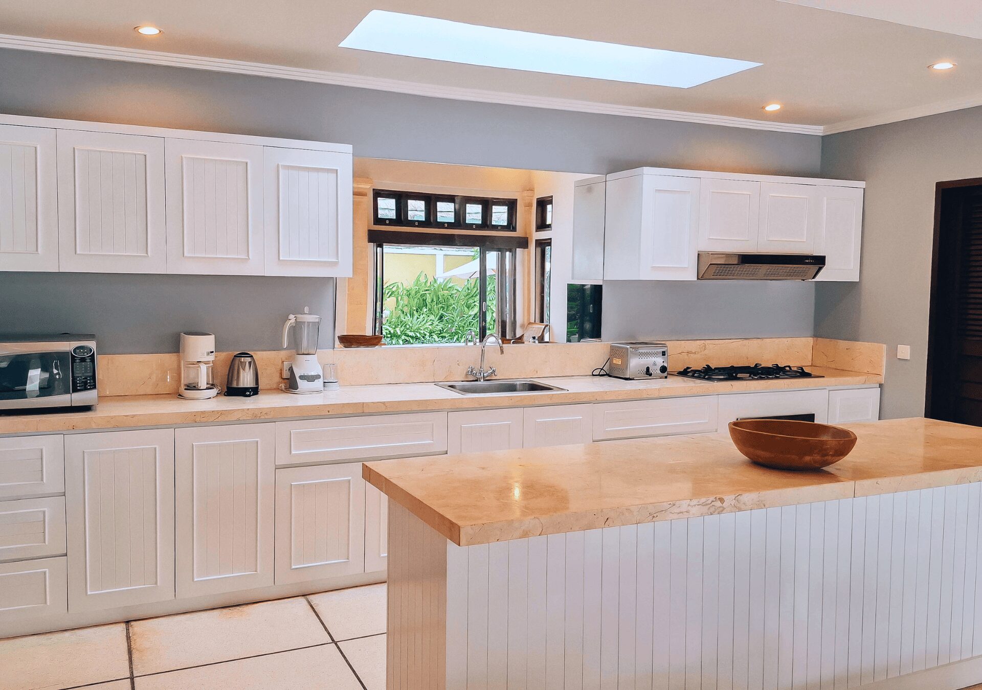 Spacious kitchen island and counter space at Villa Gembira Seminyak by Villa Bugis, offering self-catering convenience in Seminyak villas.
