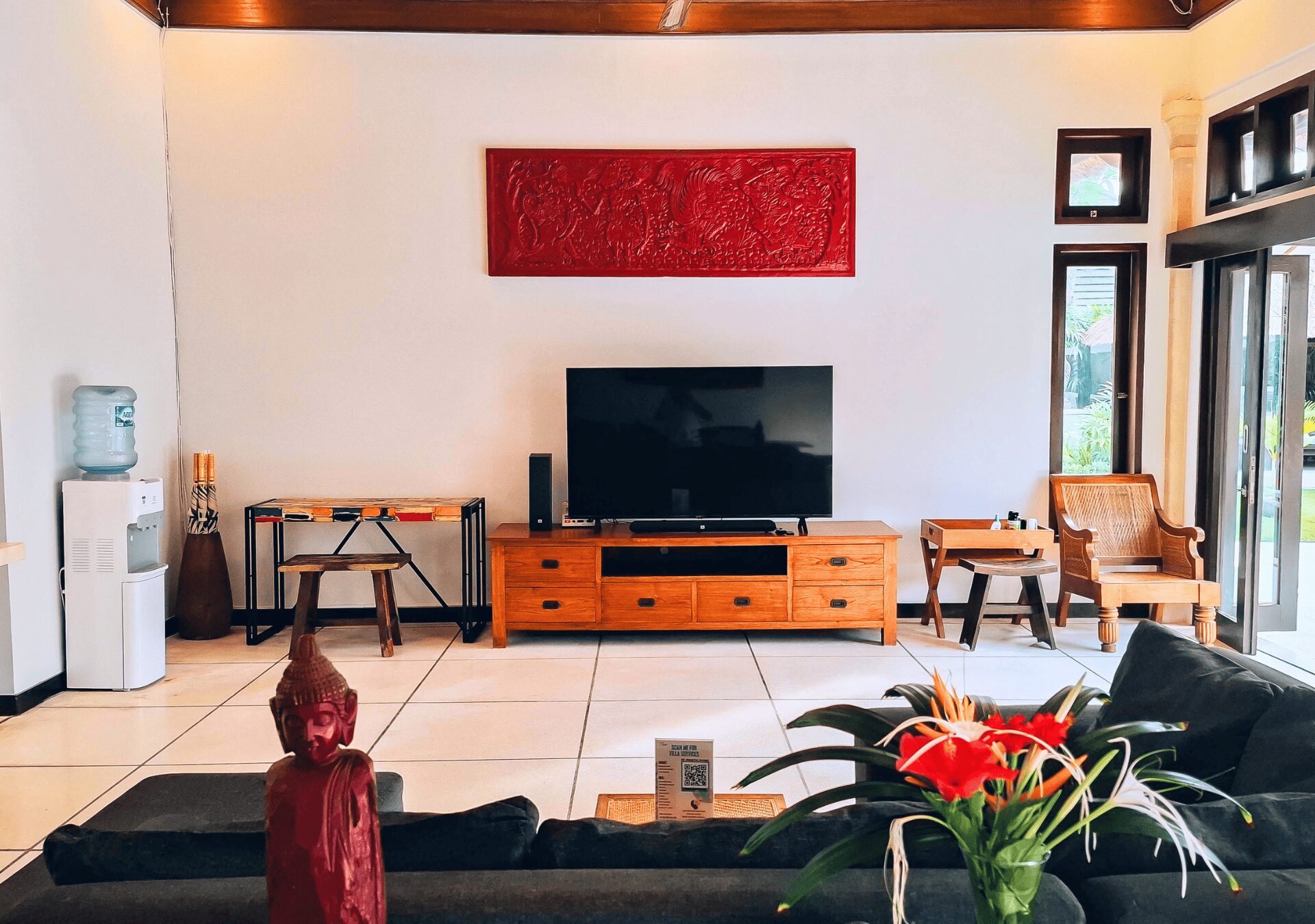 Elegant wooden decor and comfortable entertainment seating in the main living pavilion at Villa Gembira Seminyak by Villa Bugis villa Seminyak.