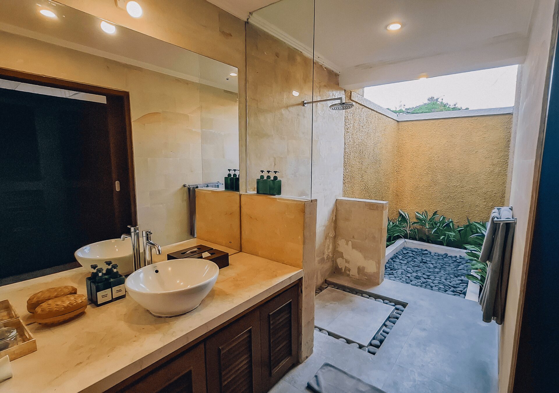 Private open-air guest bathroom attached to bedroom 4 at Villa Gembira Seminyak by Villa Bugis villa Seminyak.