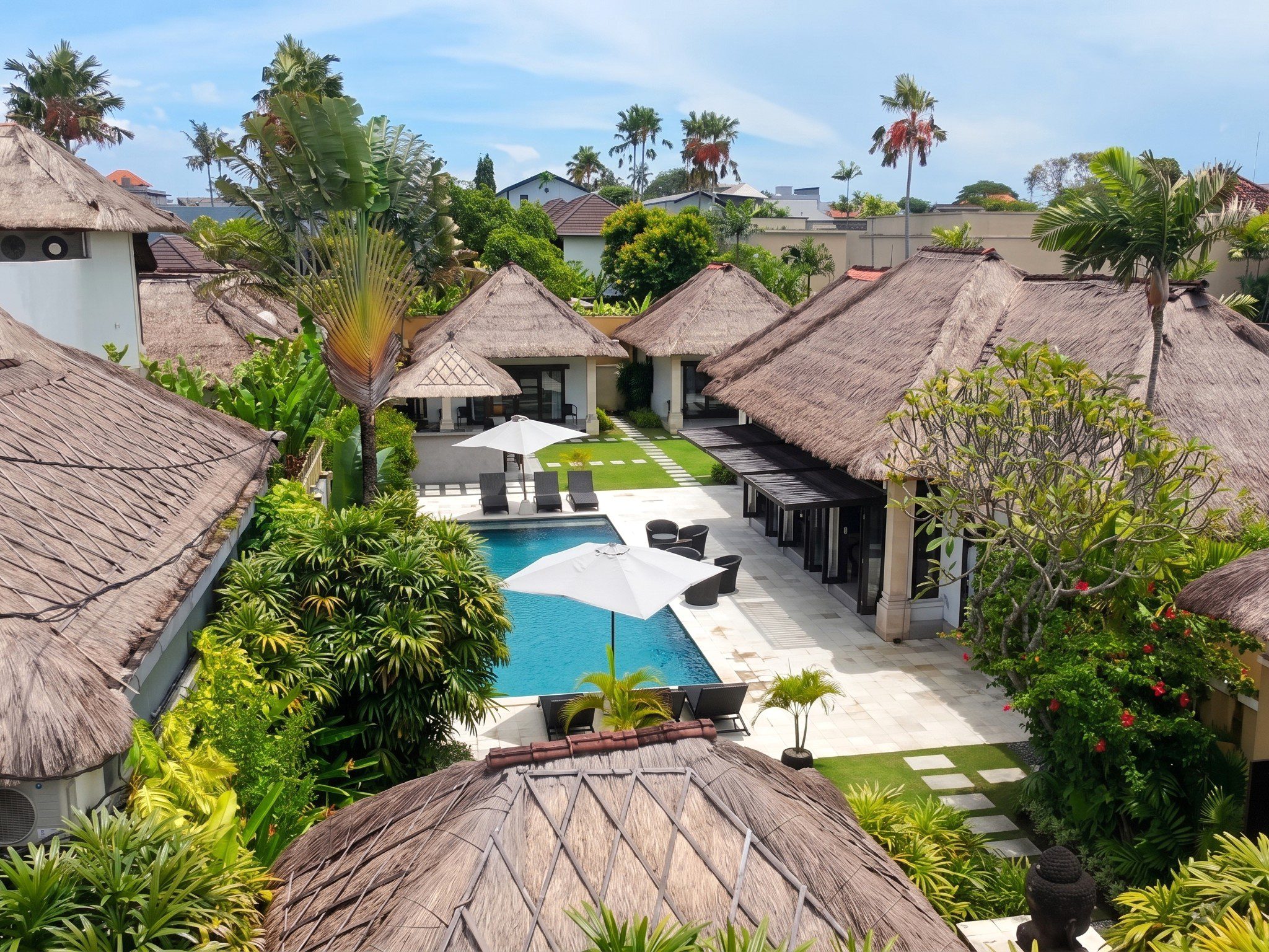 Spacious private swimming pool and lush tropical garden at Villa Gembira Seminyak