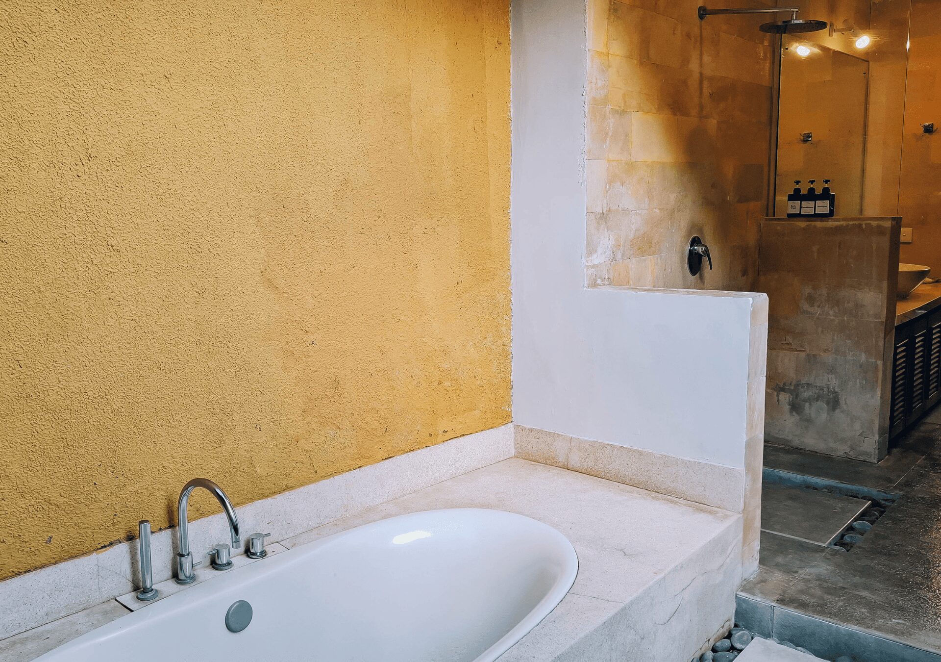 Private ensuite bathroom with a soaking bathtub and modern fixtures for bedroom 2 at Villa Gembira Seminyak by Villa Bugis Seminyak villas.