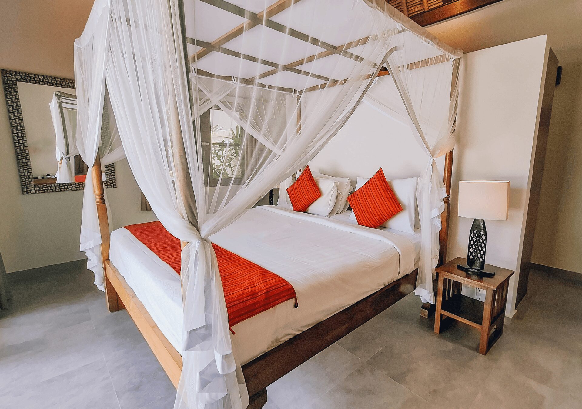 Cozy second bedroom with a comfortable king-size bed and warm lighting at Villa Gembira Seminyak by Villa Bugis, ideal for Seminyak villas guests.