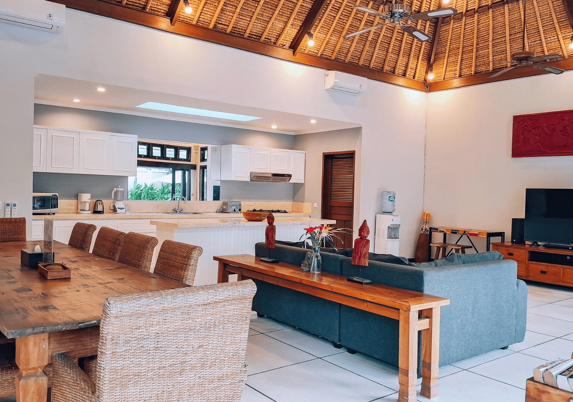 High-ceiling Balinese architectural design of the main living area at Villa Gembira Seminyak by Villa Bugis Seminyak villas.