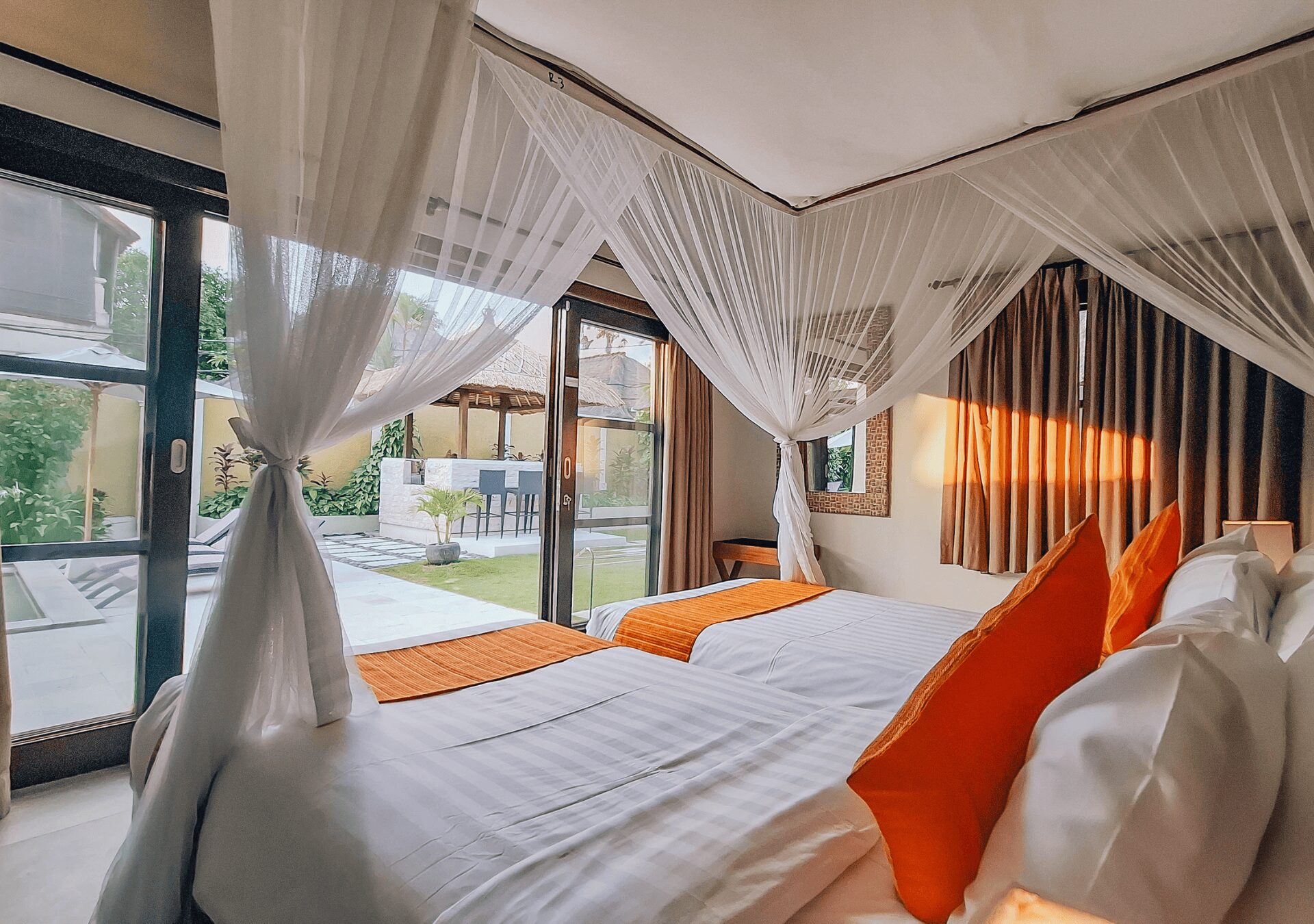 Serene third guest bedroom at Villa Gembira Seminyak by Villa Bugis villa Seminyak with premium bedding and a garden view.