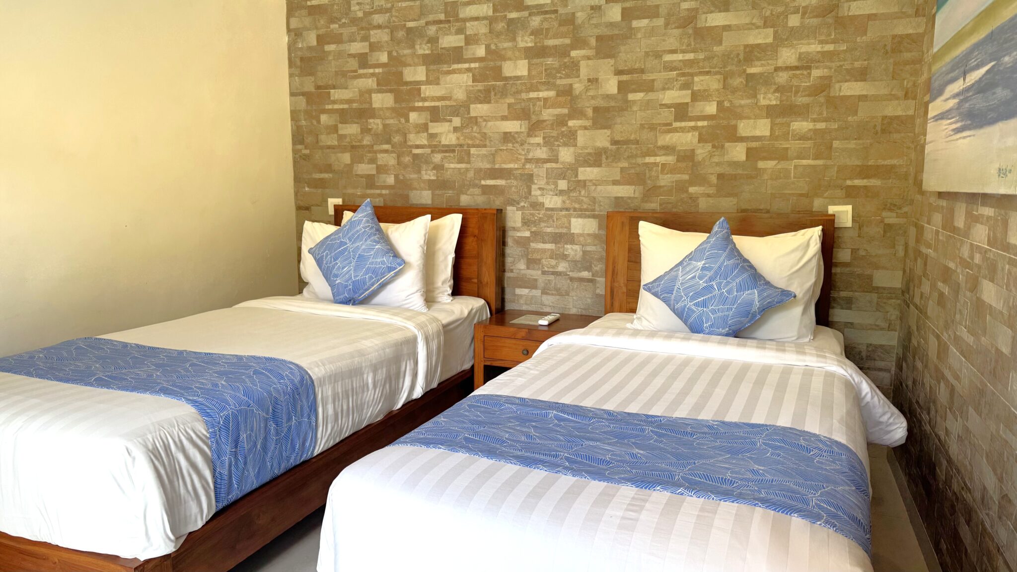 Cozy guest twin bedroom interior at Villa Ginger Seminyak by Villa Bugis villa Seminyak, featuring comfortable double single beds and air conditioning.