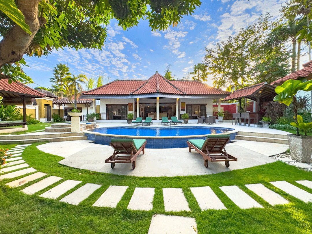 Tropical oasis landscape under full sunlight at Villa Ginger Seminyak by Villa Bugis, ideal for families seeking a premium villa Seminyak experience.