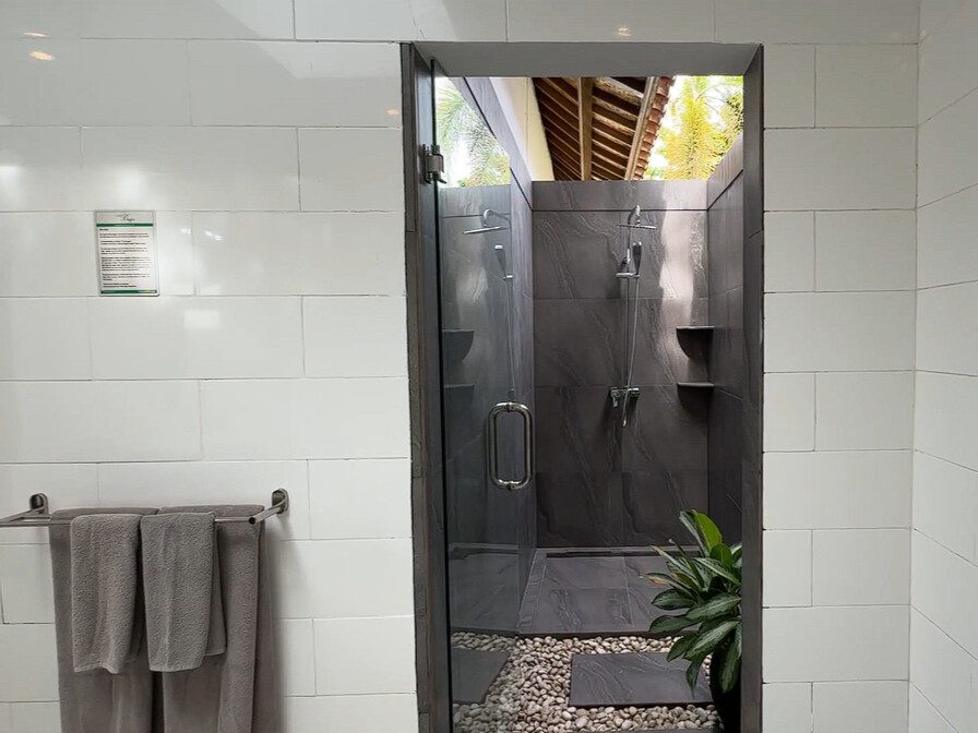 Semi-outdoor private bathroom attached to bedroom 2 at Villa Ginger Seminyak by Villa Bugis, offering a unique villa Seminyak bathing experience.