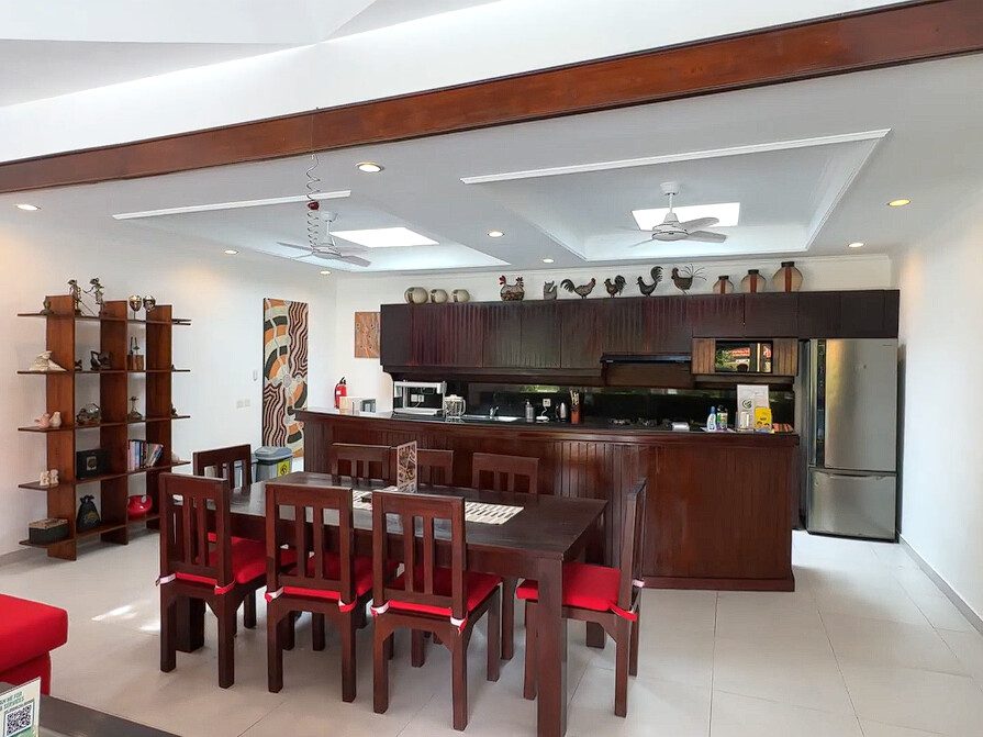 Spacious open-plan living room with comfortable plush sofas facing the private pool at Villa Ginger Seminyak by Villa Bugis villa Seminyak.