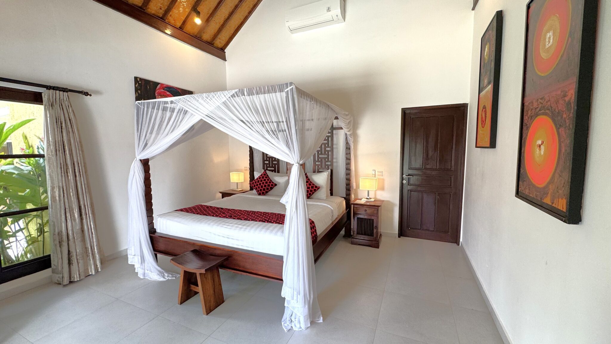 Large comfortable bed with soft natural lighting in bedroom 2 at Villa Ginger Seminyak by Villa Bugis, a highly recommended Seminyak villas choice.