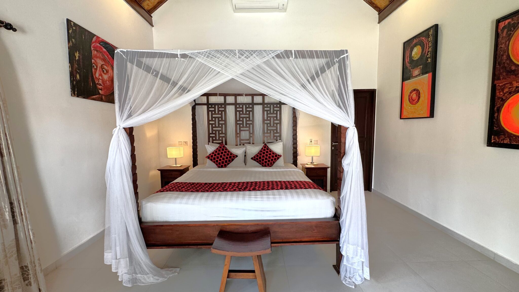 Cozy second bedroom at Villa Ginger Seminyak by Villa Bugis villa Seminyak, displaying beautiful Balinese interior accents and fully-equipped amenities.