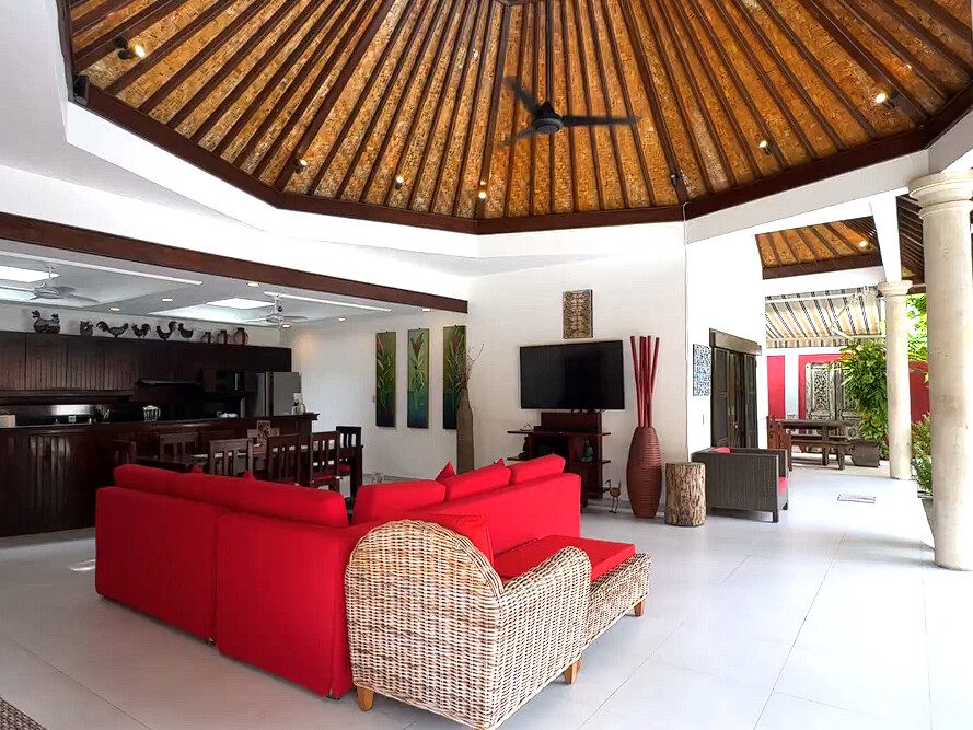High-ceiling Balinese style open living pavilion at Villa Ginger Seminyak by Villa Bugis, a signature feature of this luxury Seminyak villas property.