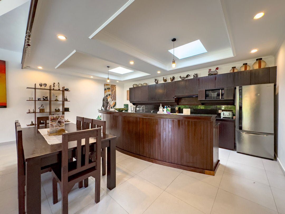 Western-standard kitchen setup with sleek cabinets and counter space at Villa Ginger Seminyak by Villa Bugis, a luxury feature for a villa Seminyak stay.
