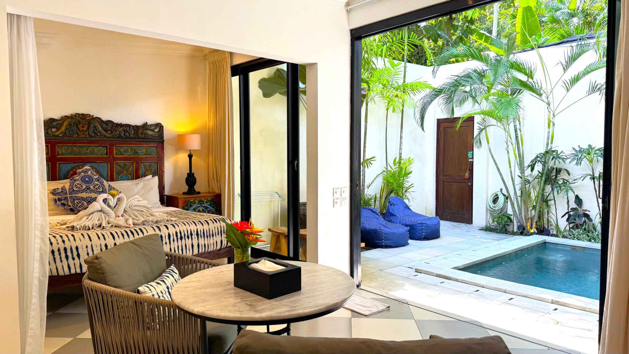 Elegant indoor pavilion combining the living and dining spaces at Villa Ibu Dua Seminyak by Villa Bugis villa Seminyak.