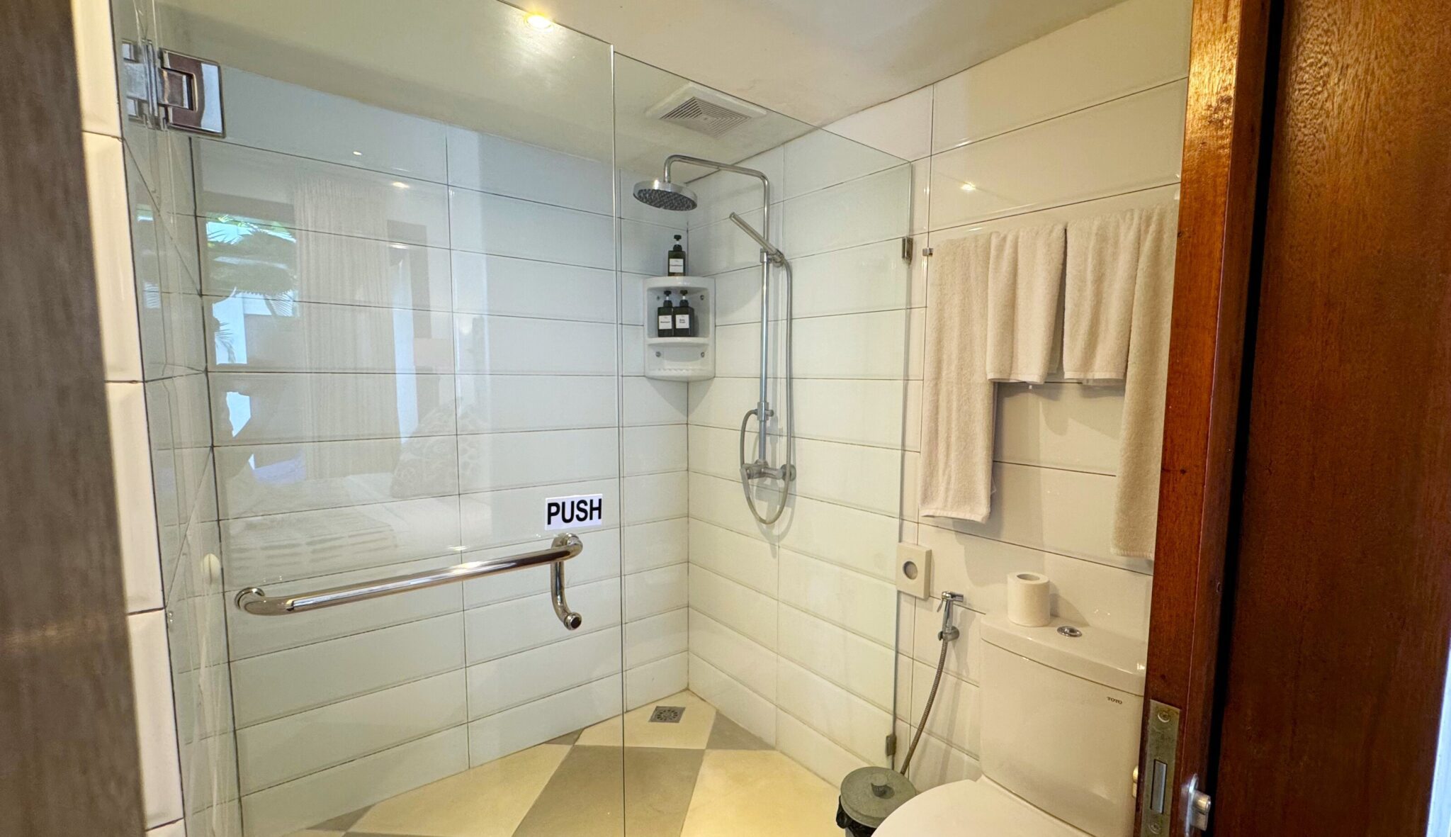 Private ensuite bathroom with a modern shower at Villa Ibu Dua Seminyak by Villa Bugis, offering a unique villa Seminyak experience.