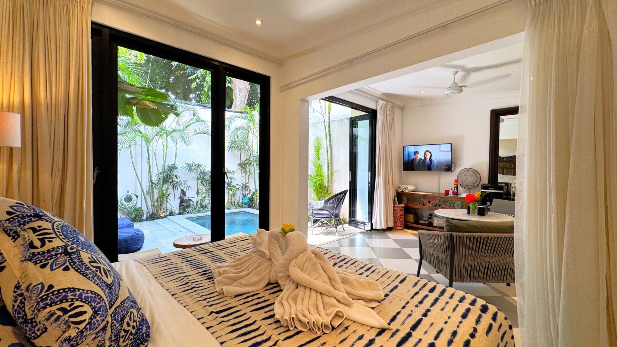 Stylishly decorated 1-bedroom suite with wooden furnishings and direct garden views at Villa Ibu Dua Seminyak by Villa Bugis villa Seminyak.