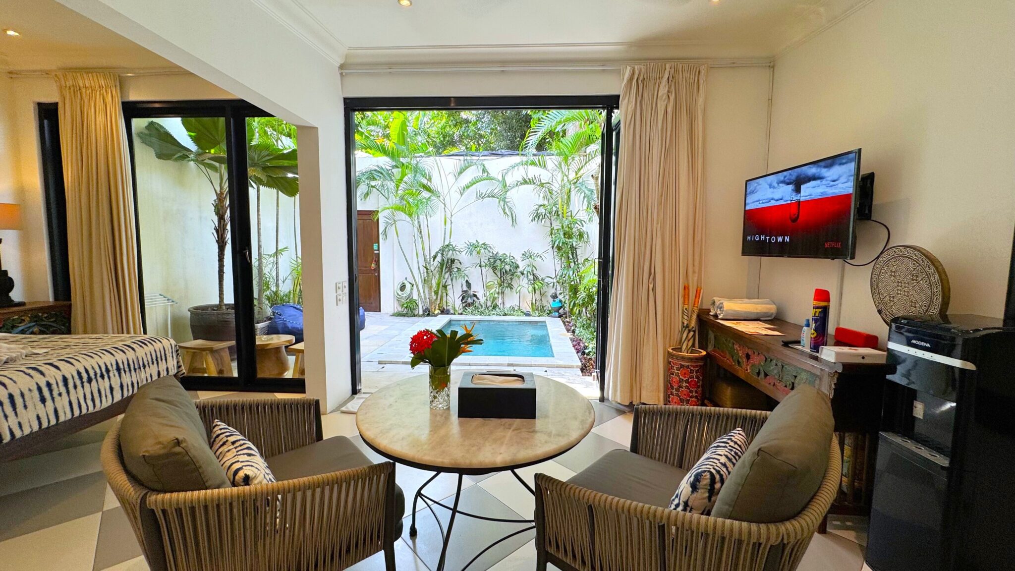 Spacious open-plan indoor living area with comfortable seating at Villa Ibu Dua Seminyak by Villa Bugis Seminyak villas.