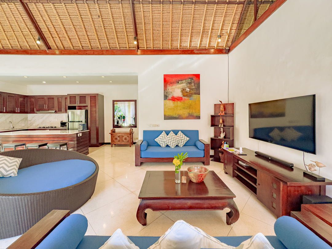 Cozy entertainment setup and lounge zone in the main living area at Villa Kebun Seminyak by Villa Bugis villa Seminyak.
